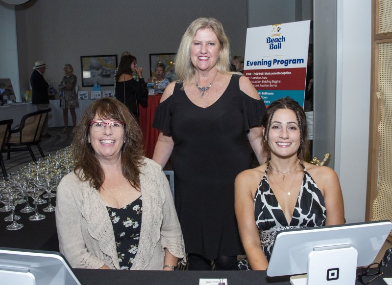 Checking guests in are (l-r) volunteer Bonnie Golden and Rehoboth Beach Museum staff members April Schmer and Christina Squillace.